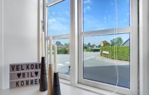 a window with a view of a street at 3 Bedroom Amazing Home In Sydals in Østerby