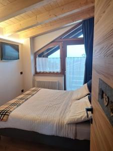 Ένα ή περισσότερα κρεβάτια σε δωμάτιο στο Apartment Chalet Naturalp +11 φωτογραφίες