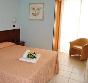 Postel nebo postele na pokoji v ubytování Hotel San Marco