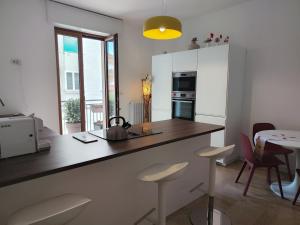 a kitchen with a counter with a tea kettle on it at Corsica 23 - Affitti Brevi Italia in Gravina in Puglia +20 photos