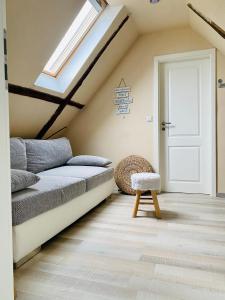 a attic bedroom with a bed and a skylight at Casa del Sol in Schwaigern +14 photos