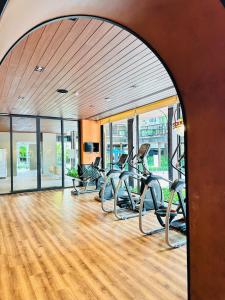 a gym with a row of treadmills in a room at Joy house 1 bedroom Lahabana HuaHin in Hua Hin