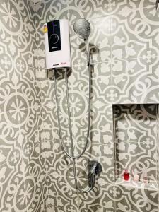 a bathroom with a blow dryer and a mirror at Joy house 1 bedroom Lahabana HuaHin in Hua Hin