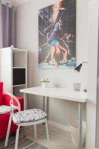 Televízia a/alebo spoločenská miestnosť v ubytovaní Apartamenty Startowa Gdańsk