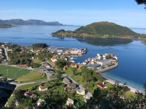 an aerial view of a small town on a lake at Seljesanden Apartment in Selje