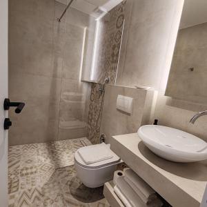 a bathroom with a sink and a toilet and a shower at Mandrina 10 Free Parking in Sarajevo +48 photos