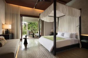 Кровать или кровати в номере Alila Ubud