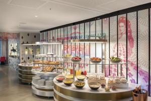 a buffet line with many different types of food at nhow Frankfurt in Frankfurt
