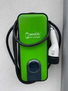 a green cell phone in a holder on a wall at Hotel Jesolo Sand in Lido di Jesolo +84 photos