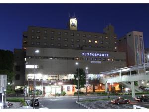 a large building with a clock tower on top of it at Minamisenri Crystal Hotel - Vacation STAY 78162v in Suita