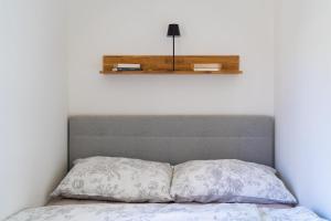 Postel nebo postele na pokoji v ubytování Forest Sky Suite - Graz