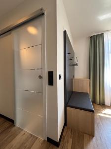 Postel nebo postele na pokoji v ubytování Hotel am Stadthaus