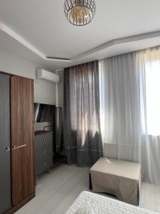 TV o dispositivi per l'intrattenimento presso Guest House Inn Side