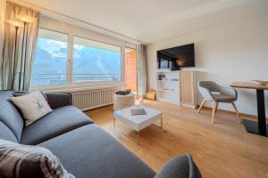 TV a/nebo společenská místnost v ubytování Fortuna 4 by Arosa Vacations
