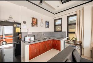 a kitchen with a sink and a counter top at Chic and Cozy Retreat in San Fernando La Union in San Fernando
