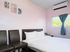A bed or beds in a room at A-Lang Homestay