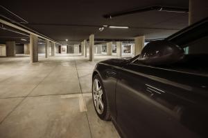 a black car parked in an empty parking garage at Hotel Las Vegas in Lido di Jesolo