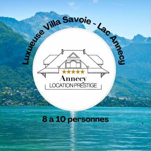 a picture of a lake with a mountain in the background at Villa Savoie - luxe et sérénité- piscine et jacuzzi - vue panoramique sur le lac d Annecy in Veyrier-du-Lac