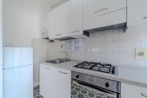 Kuchyň nebo kuchyňský kout v ubytování GuestHost - Cozy Flat in the Heart of Rapallo