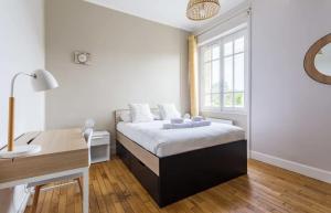 Posteľ alebo postele v izbe v ubytovaní Saint-Exupery - Bel appartement rénové/Parking
