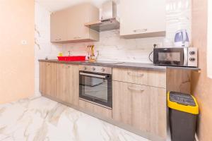 Kuchyň nebo kuchyňský kout v ubytování Apartments Olivera