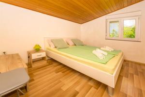 Postel nebo postele na pokoji v ubytování Apartments Olivera