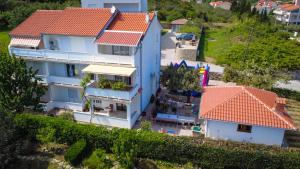 an aerial view of a house with an orange roof at Apartments Biserka G in Palit
