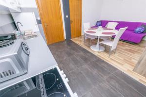 Kuchyň nebo kuchyňský kout v ubytování Apartments Olivera
