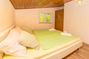 Postel nebo postele na pokoji v ubytování Apartments Olivera