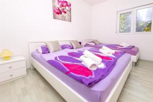 Postel nebo postele na pokoji v ubytování Apartments Olivera