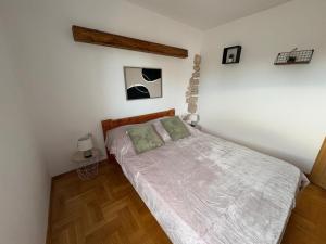 Posteľ alebo postele v izbe v ubytovaní Apartments Neno