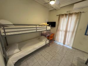 Ένα ή περισσότερα κρεβάτια σε δωμάτιο στο Seaside Apartments & Rooms Kampouri