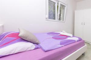 Postel nebo postele na pokoji v ubytování Apartments Olivera