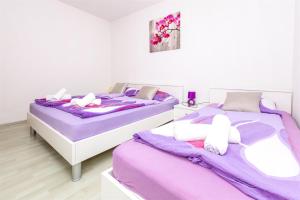 Postel nebo postele na pokoji v ubytování Apartments Olivera