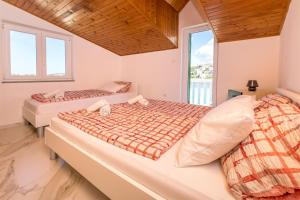 Posteľ alebo postele v izbe v ubytovaní Apartments Olivera