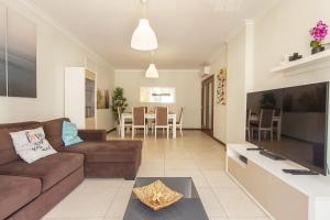 a living room with a couch and a table at B03 - Luxury 2 Bed Lagos Marina in Lagos