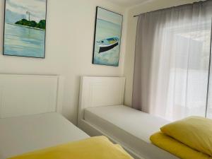 En eller flere senge i et værelse på Seasight + 43 billeder