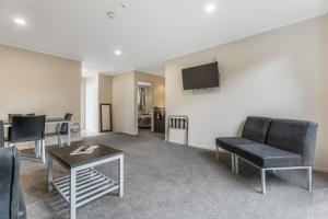 TV a/nebo společenská místnost v ubytování Dannemora Motor Inn