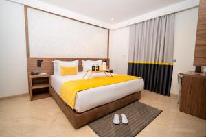 Postel nebo postele na pokoji v ubytování Oum Palace Hotel & Spa