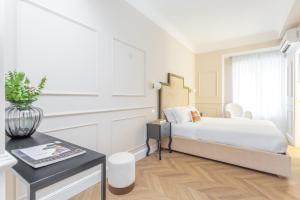A bed or beds in a room at Rome Central Inn
