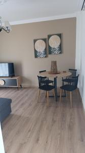 a dining room with a table and two chairs at La Bella casa kavala in Kavala +20 photos