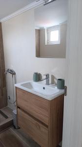 a bathroom with a sink and a mirror at La Bella casa kavala in Kavala