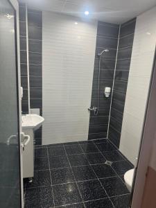 a bathroom with a shower and a sink at Комлекс Кристо in Blagoevgrad +12 photos