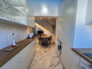 a kitchen and dining room with a table and a dining room at HL 014 Holiday Rental 3 bedroom villa on HDA Golf Resort in Fuente Alamo +21 photos