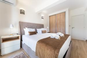 Postel nebo postele na pokoji v ubytování Apartamento Pine by Algarve Holidays + 12 fotografií