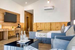 a hotel room with a bed and a tv at Corbett Elegant Retreat in Rāmnagar