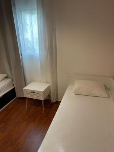 Postel nebo postele na pokoji v ubytování Marias House Rafina