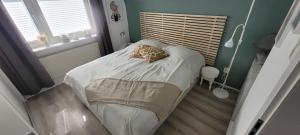 a small bedroom with a bed with a pillow on it at Büsumhaus Birgit in Büsum