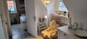 a room with a bedroom with a bed and a desk at Büsumhaus Birgit in Büsum +18 photos