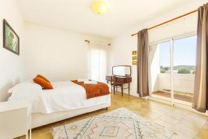 Ένα ή περισσότερα κρεβάτια σε δωμάτιο στο Luz Vista Mar Apartment